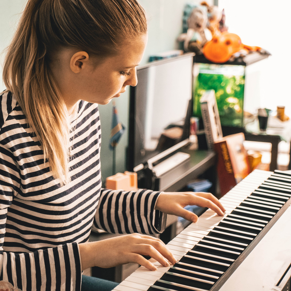 girl playing piano