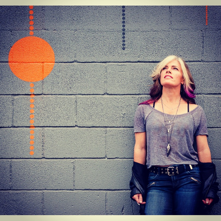 Screenshot Learning to be cool. Pink AND bleached hair. Leather jacket. Studded belt. Of course.